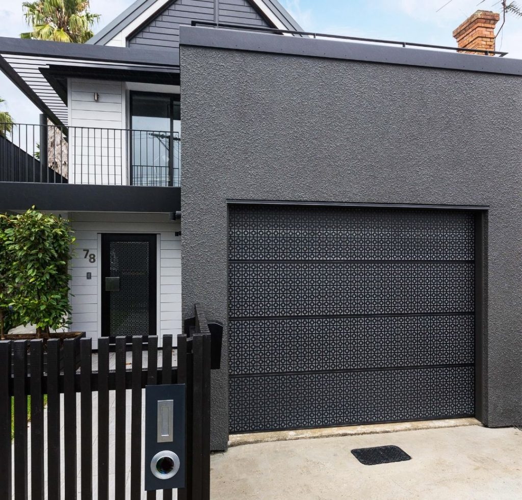 Glass Garage Door with Laser-Cut Aluminium Overlay