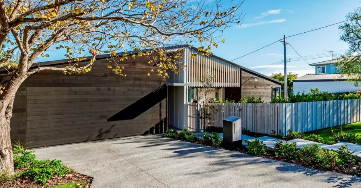 Brown Horizontal Shiplap Flushmount Garage Door on Architectural Home