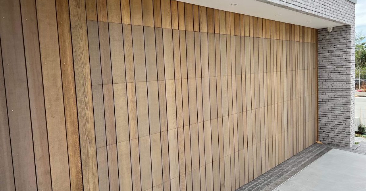 Wood Garage Door with stone surrounds